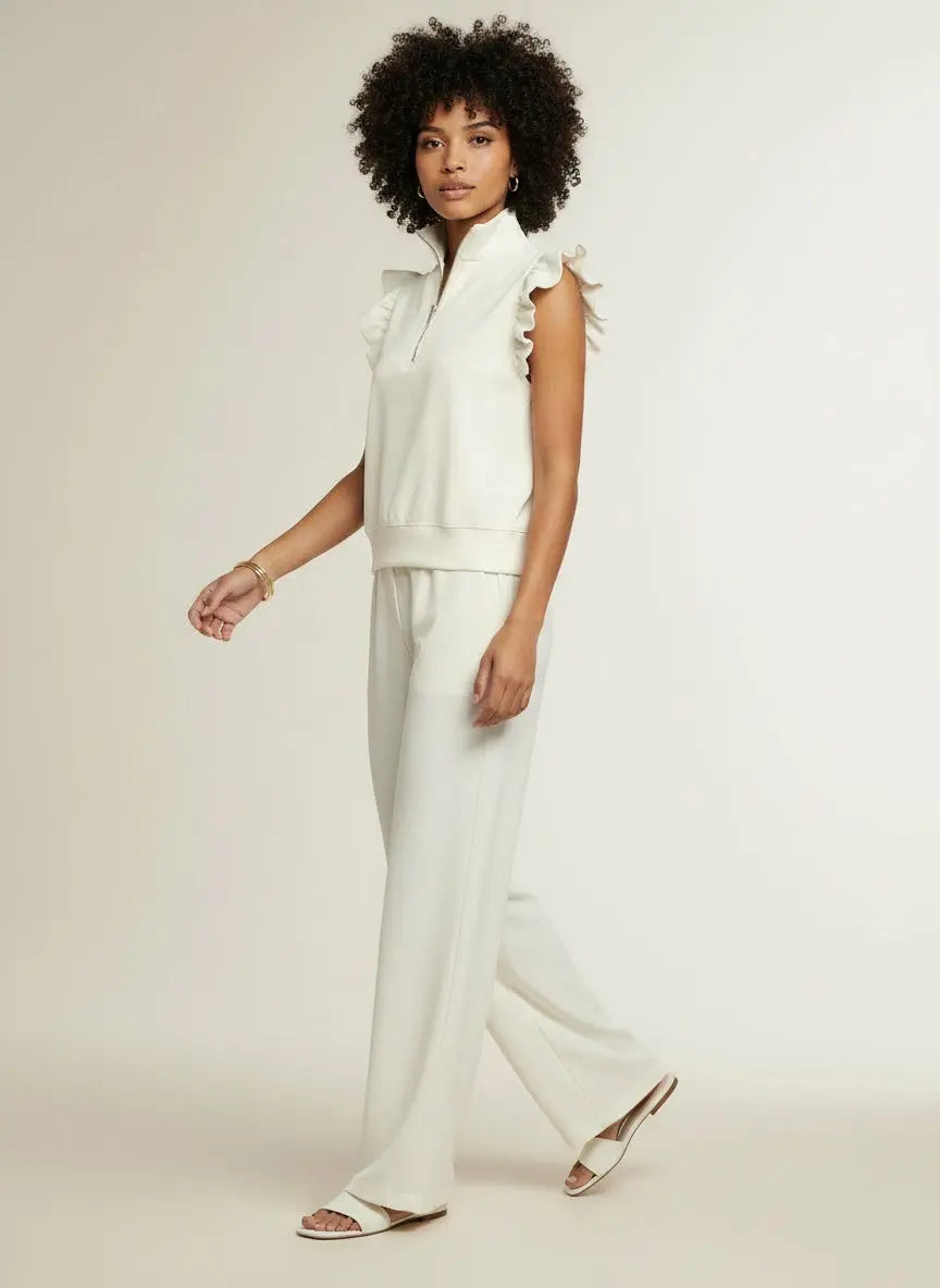 Model walking while wearing Zipped up Collared Ruffled Short Sleeve Blouse