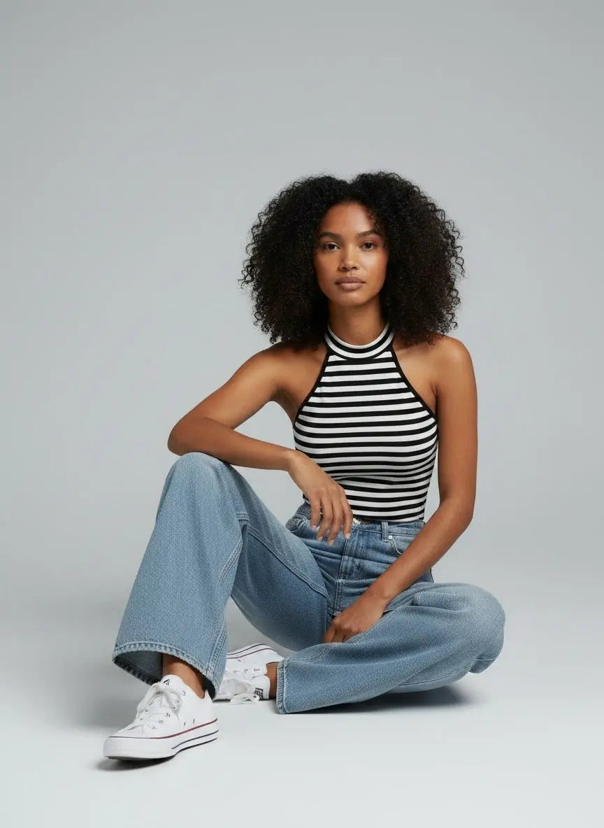 Model sitting while wearing Striped Cutout Shoulder Cami