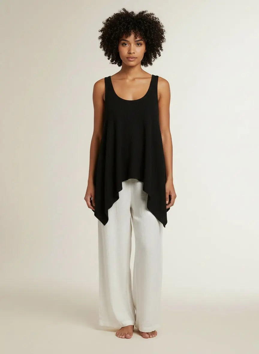 Full body view of the model wearing BiBi High and Low Flare Knit Tank Top