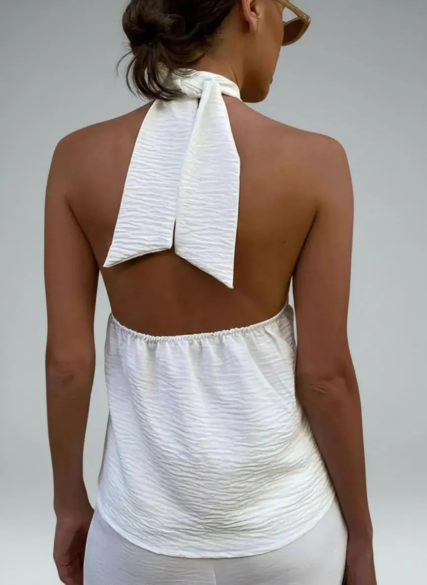 Back pose of the model wearing Knotted Halter Neck Cami
