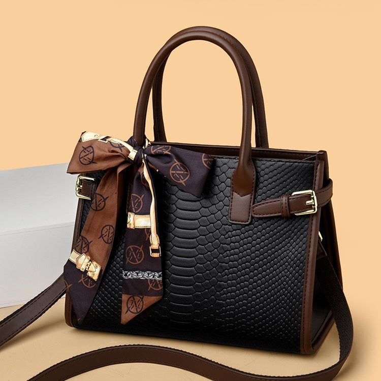 Embossed snakeskin pattern handbag