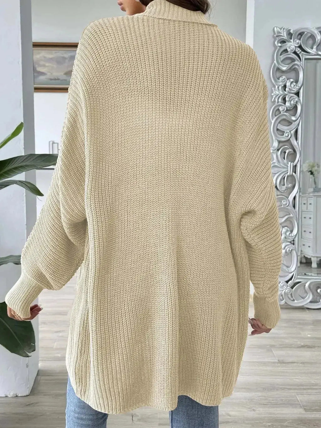 Cream oversized knit cardigan with ribbed texture, modern minimalist women's fashion