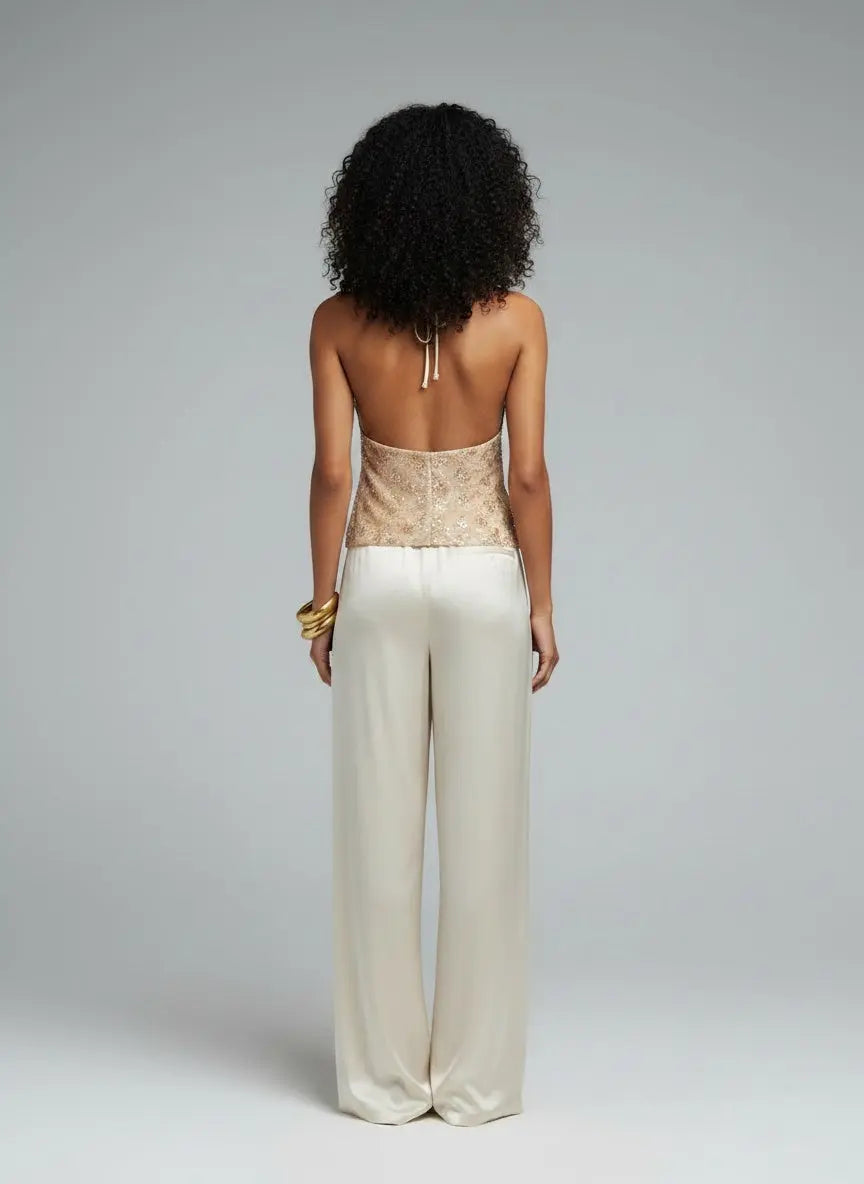 Back pose of the model wearing Sequin Embellished Halter Neck Cami