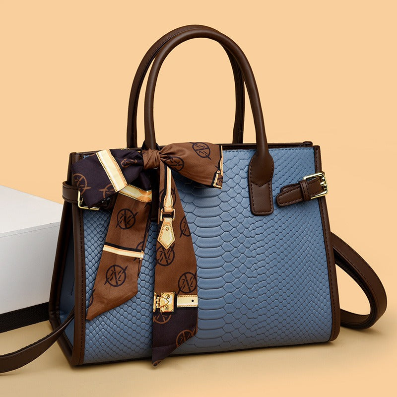 Embossed snakeskin pattern handbag