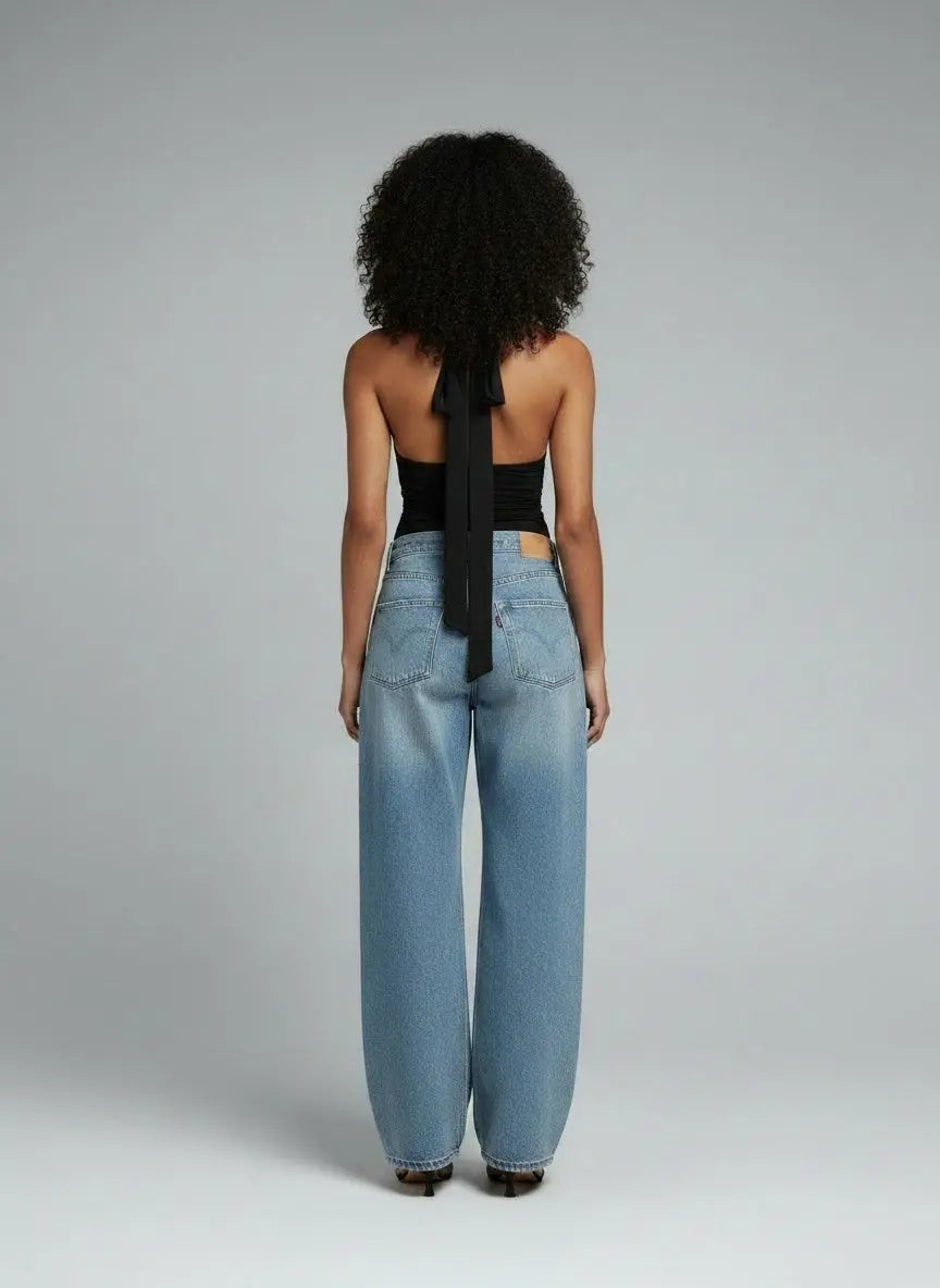 Back pose of the model wearing Halter Neck Tie Cami