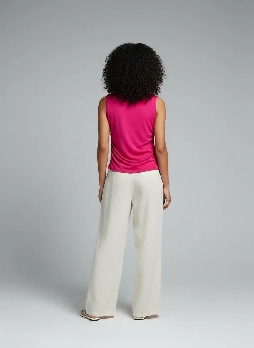 Back pose of the model wearing Ruched Mock Neck Tank