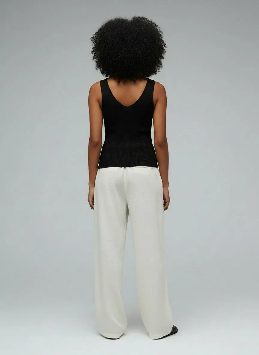 Back pose of the model wearing V-Neck Slim Fit Tank