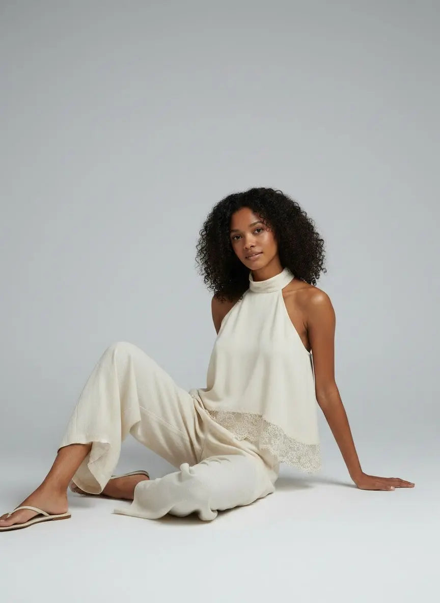 Model sitting while wearing Halter Neck Lace Trim Cami
