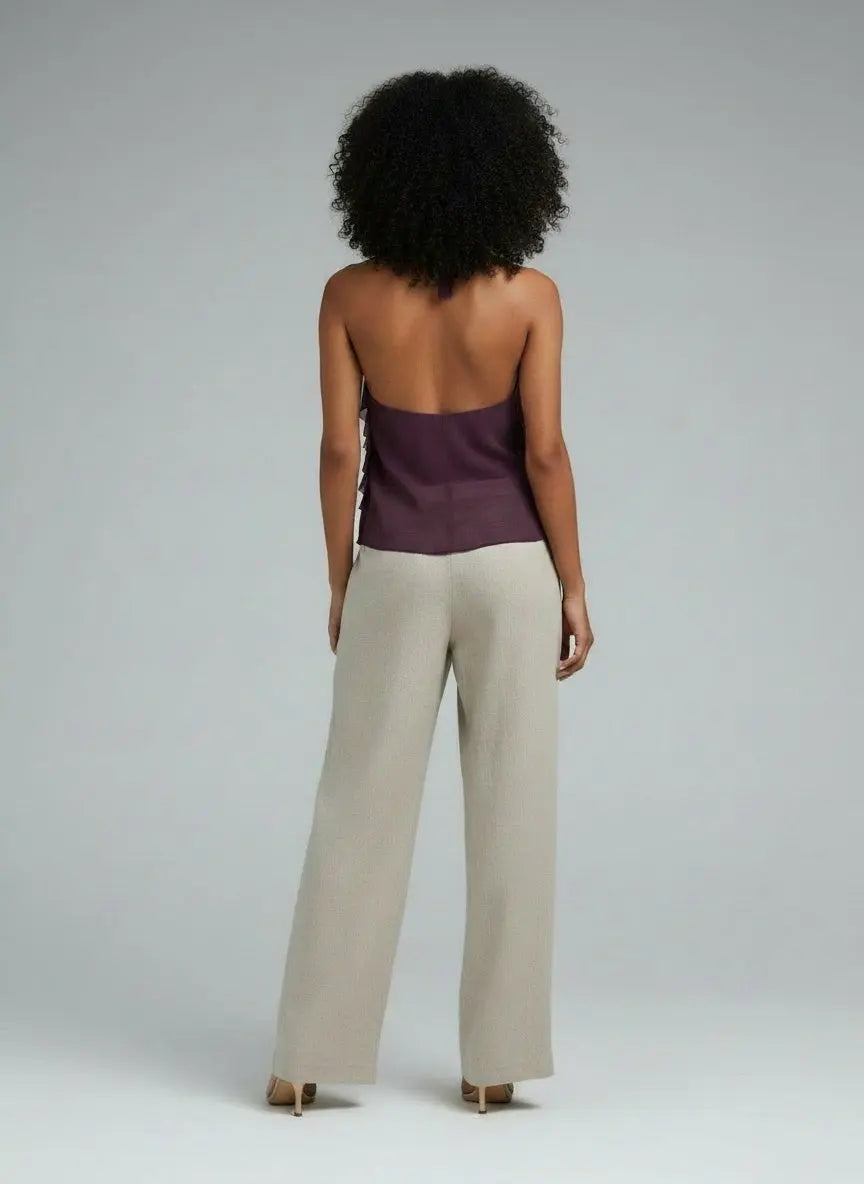 Back pose of the model wearing Ruffled Halter Neck Cami
