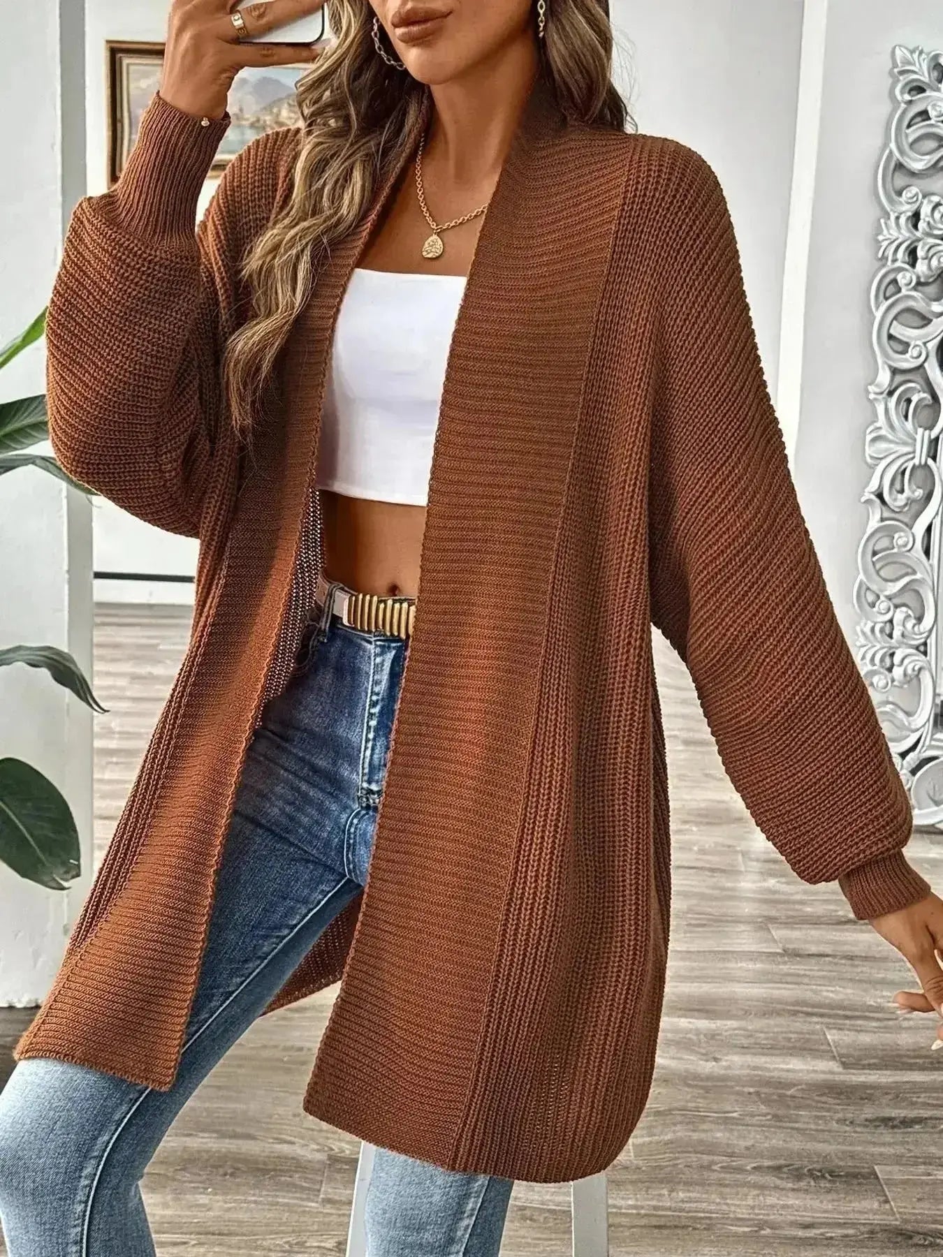 Brown ribbed knit cardigan for women, styled with white crop top and jeans, modern minimalist fashion