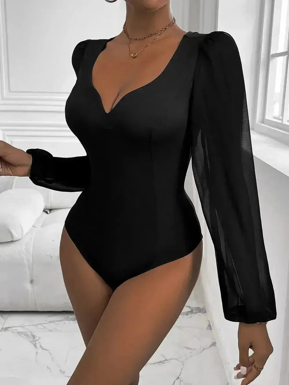 Black long-sleeve bodysuit with puff sleeves and deep V-neck for women's fashion