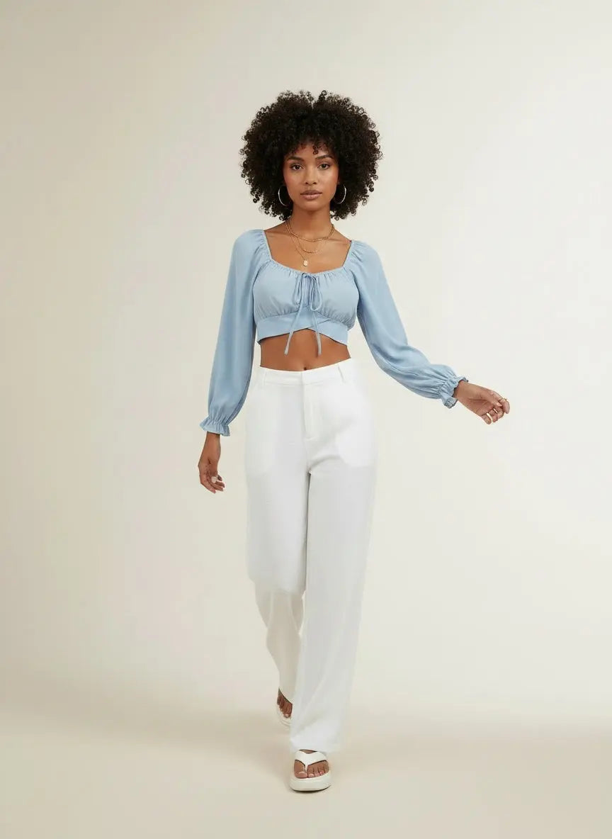 Model walking while wearing Honey Raglan Sleeve Cropped Blouse