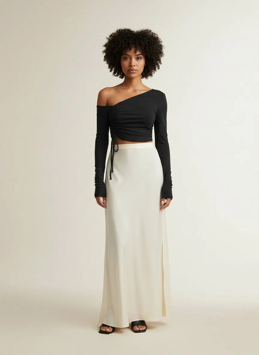 Full body view of the model wearing Ivy Lane Asymmetrical Long Sleeve Side Tie Blouse