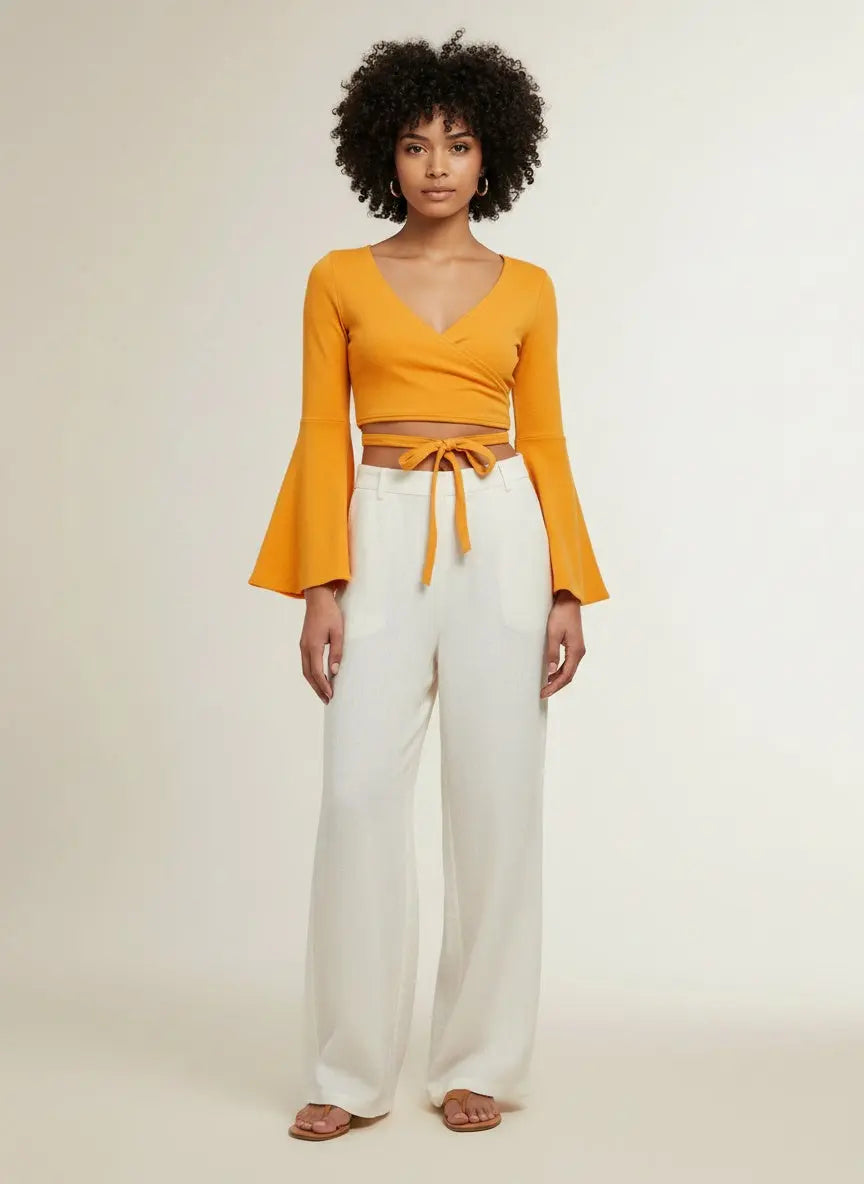 Full body view of the model wearing Tie Front Flare Sleeve Cropped Top
