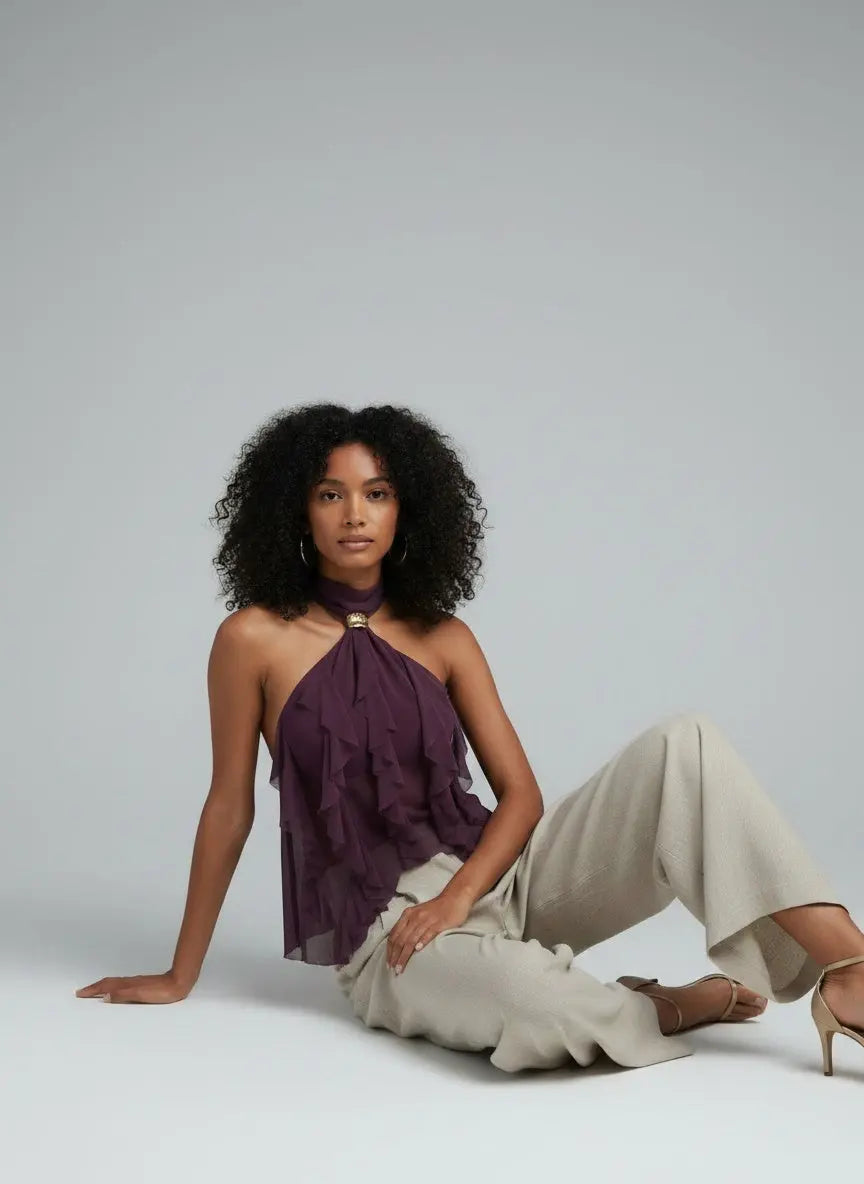 Model sitting while wearing Ruffled Halter Neck Cami